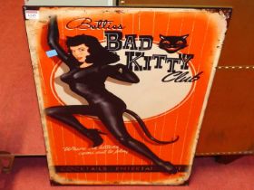 A printed tin wall sign titled Bad Kitty Club, 70 x 50cm