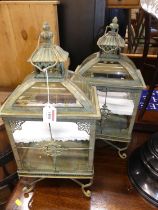 A pair of contemporary painted metal hanging display cases, with Chinese pagoda tops, height 56cm