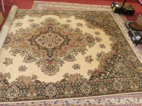 A Persian style cream ground woollen tabriz rug, machine woven, European manufactured Some