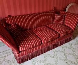 A contemporary red striped upholstered three seater Knole settee, with typical drop-ends and