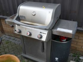A Weber freestanding gas fired barbeque