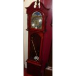 A contemporary grandmother clock, with moon phased arch dial, glazed trunk door, and sundry