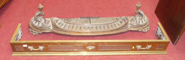 An Edwardian pierced brass curb fender, width 139cm, together with a cast iron fender (2)
