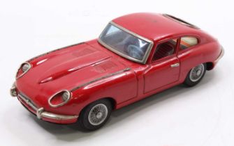 A Nomura TN Toys of Japan tinplate friction drive E Type Jaguar comprising a pressed steel body in