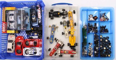 A collection of vintage Scalextric slot cars and spare parts including a boxed JPS Formula 1
