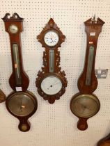 Two 19th century mahogany and inlaid wheel barometers; together with an incomplete wheel