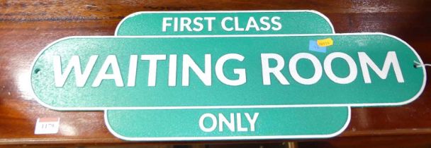 A painted cast metal wall sign titled First Class Waiting Room Only, 21 x 59.5cm