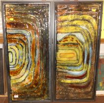 A pair of contemporary enamelled glass panels, in metal frames, gross dimensions 84 x 38cm