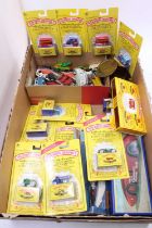 A collection of mixed loose and boxed diecasts, with examples including some Matchbox Series '