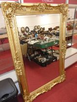 A large contemporary floral gilt framed bevelled rectangular floor mirror, 185 x 121cm