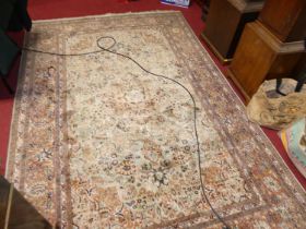 A Persian woollen kashmiri rug, with all over heavy floral ground within trailing tramline