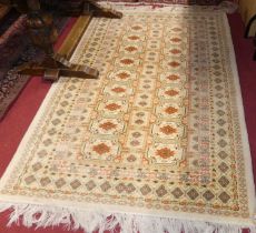 A Persian woollen cream ground bokara rug, 190 x 125cm