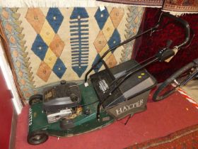 A Hayter Harrier 48 Quantum petrol driven lawnmower, with grass collecting box