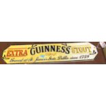 A reproduction cast iron sign for Guinness, w.56cm