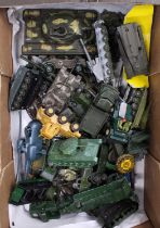 A large box of mixed plastic and diecast military vehicles, with examples including a Dinky Toys