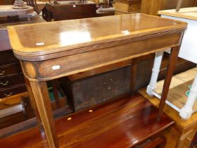 A 19th century mahogany and satinwood cross banded round cornered fold over tea table, having rear