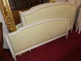 A French white painted kingsize lit-en-bateau, having green fabric upholstered inset padded head and