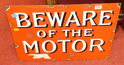 An enamel on metal wall sign titled Beware of the Motor, 37 x 52.5cm