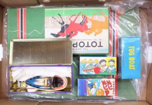 A collection of vintage children's games comprising a boxed Totopoly board game, and 4 tinplate