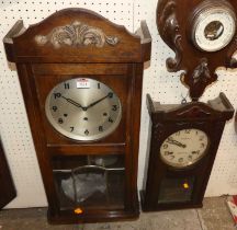 Two 1930s oak drop trunk wall clocks
