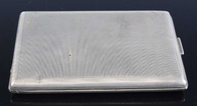 A WW II German white metal pocket cigarette case, of hinged rectangular form with engine turned