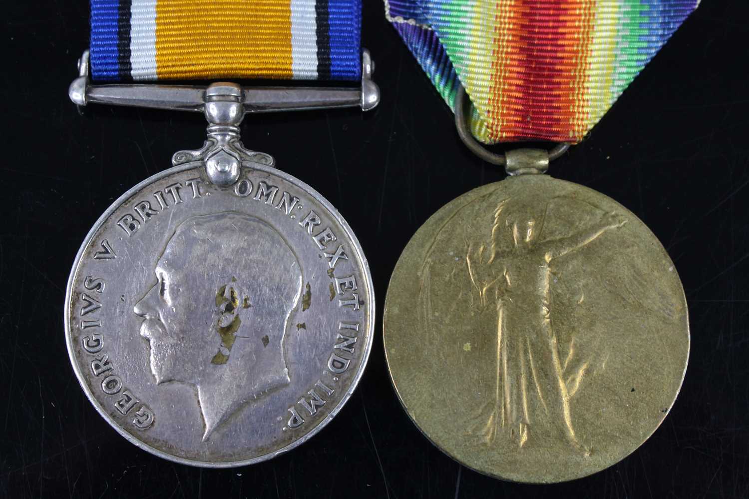A WW I British War and Victory pair, naming 57611. PTE. F. WILKINS. SUFF. R. (2)