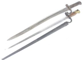 A French Model 1874 Gras bayonet, the 52.5cm blade inscribed to the back edge Mre d' armes de St