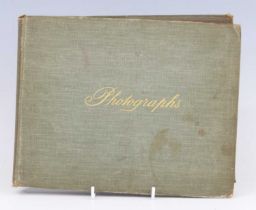An early 20th century photograph album, the opening page hand written "Photographs taken by