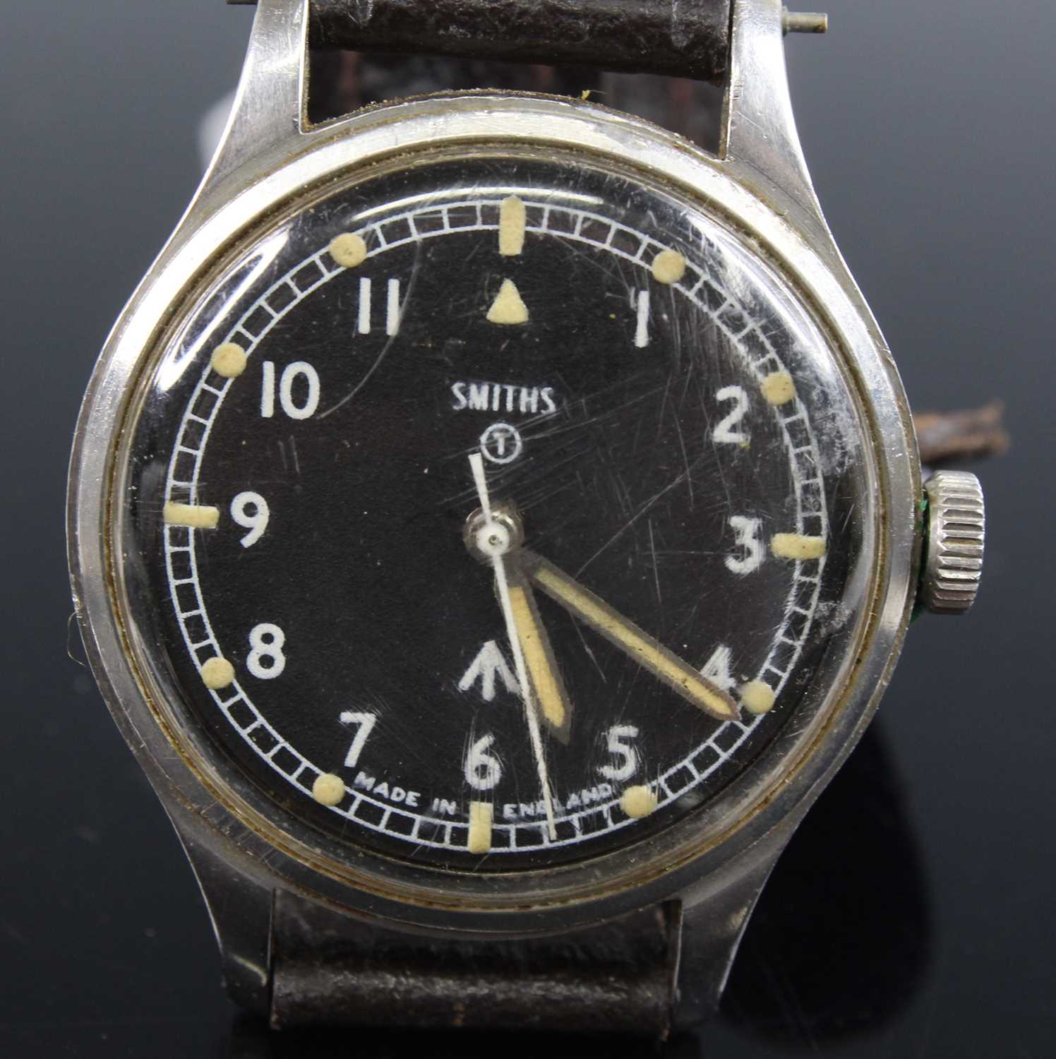 A 1960's Smiths British Military Issue gentleman's wristwatch, having a signed black enamel dial