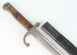 A Brazilian 1908/34 pattern Mauser bayonet, having a 38cm single edged fullered blade, the hooked