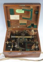 A 20th century lacquered brass theodolite, having a rack and pinion focusing action and silvered