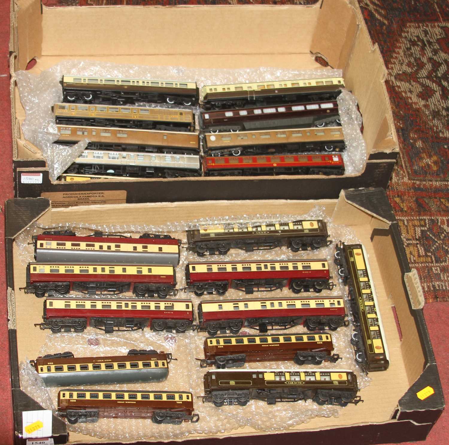 Two trays containing a quantity of 00 gauge passenger stock and rolling stock to include Triang