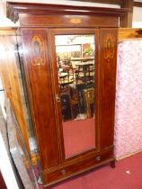 A circa 1900 mahogany satin wood and further chequer strung single mirror door wardrobe, having