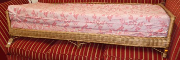 A wicker day bed, length 185cm