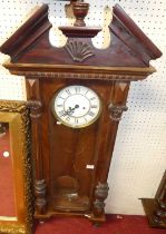A late 19th century walnut cased Vienna regulator having an eight-day weight driven movement by