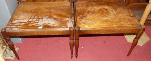 A pair of contemporary mahogany low occasional tables, with proud corners and raised on slender