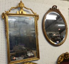 Three various gilt wood framed wall mirrors, one of oval form, one of arched form, the other of