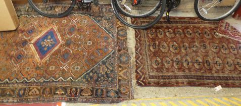 A Persian woollen rust ground Shiraz rug, 192 x 157cm, together with a Persian woollen red ground