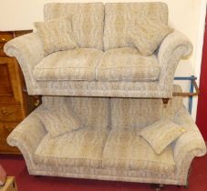 A contemporary Parker Knoll floral decorated two-piece suite, comprising; three-seater sofa and a