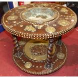 An Eastern hardwood brass mounted and further studded cylindrical two-tier wash stand, each tier