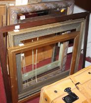 A gilt composition framed and bevelled wall mirror; together with three various picture frames (4)