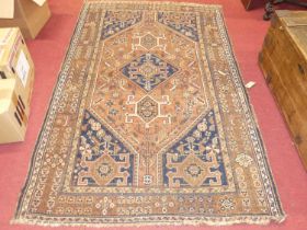 Three various Persian woollen red and blue ground Heriz rugs, each slightly worn to ground, each