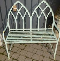 A painted wrought metal strap work two seater bench in the Regency taste, width 102cm