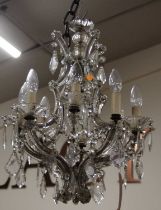 An early 20th century cut crystal dropped glass hanging eight light electrolier (one upper sconce