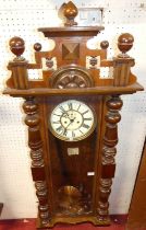 A circa 1900 walnut Vienna wall clock by Gustav Becker, having signed white enamel Roman dial,