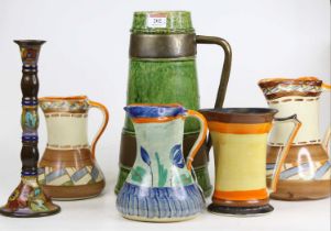 An early 20th century green glazed and brass mounted pottery jug, height 33cm, together with various