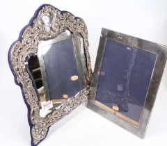 An Edwardian silver mounted easel dressing table mirror, having a shaped bevelled plate,