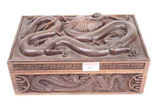 A Chinese carved hardwood box, decorated with dragons, width 27cm
