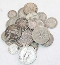 A collection of British pre-decimal silver coinage to include a victorian shilling 1872 (holed),