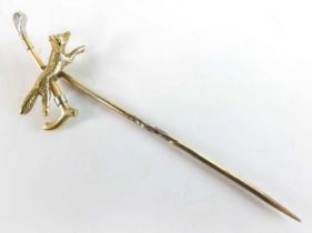 A yellow metal tie-pin formed as a fox and riding crop, unmarked but tests as approx 14ct gold, 1.